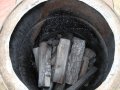 Charcoal making with logs from Tongham Wood